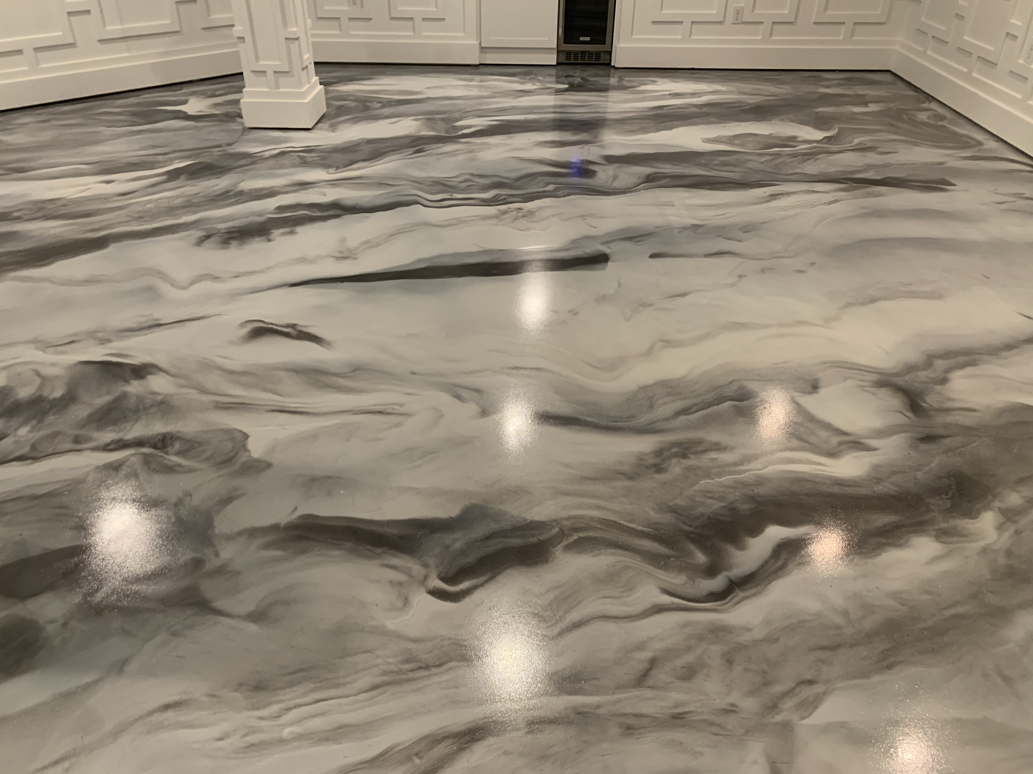 Grey metallic epoxy flooring in a residential setting